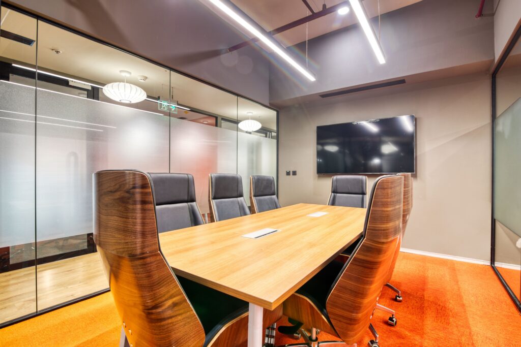 Furnished Office Space in Karachi for Ready-to-Move Businesses Sophisticated conference room with sleek furniture and glass walls. Ideal for business meetings.